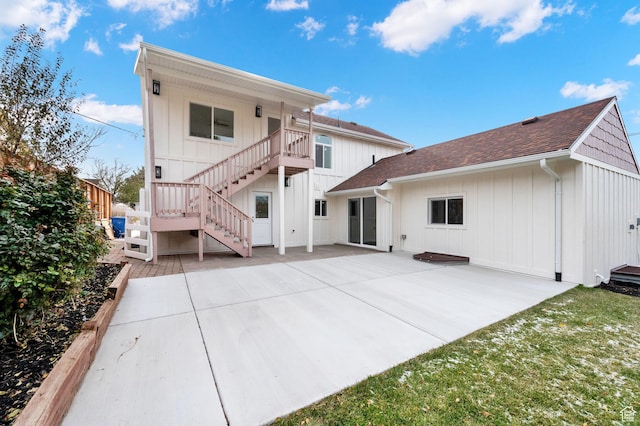 2745 E 3100 S, Millcreek, UT 84109 - rear view of house with a patio area, board and batten siding, and stairs