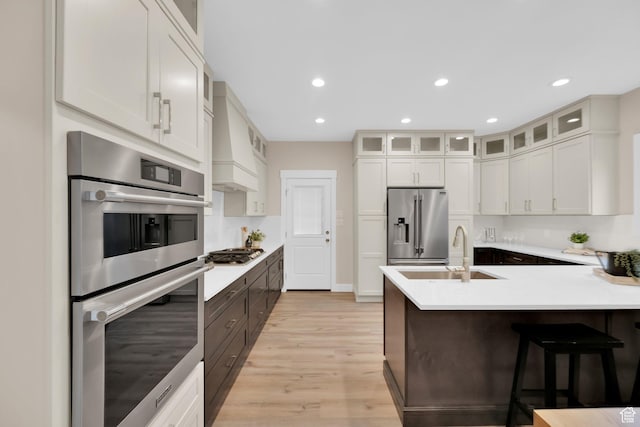 2745 E 3100 S, Millcreek, UT 84109 - kitchen with a peninsula, stainless steel appliances, glass insert cabinets, and a sink