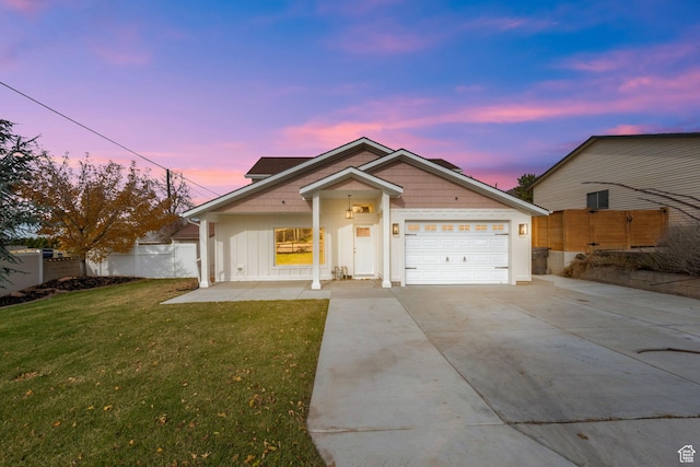2745 E 3100 S, Millcreek, UT 84109 - view of front facade featuring concrete driveway, fence, a garage, and a front lawn