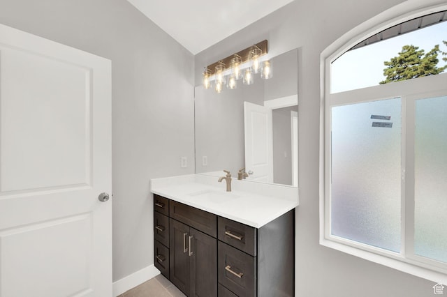 2745 E 3100 S, Millcreek, UT 84109 - bathroom featuring vanity, vaulted ceiling, and baseboards