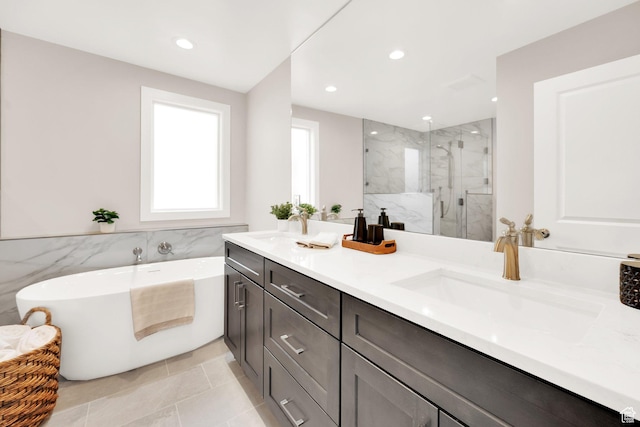 2745 E 3100 S, Millcreek, UT 84109 - bathroom with double vanity, a freestanding tub, a marble finish shower, and a sink