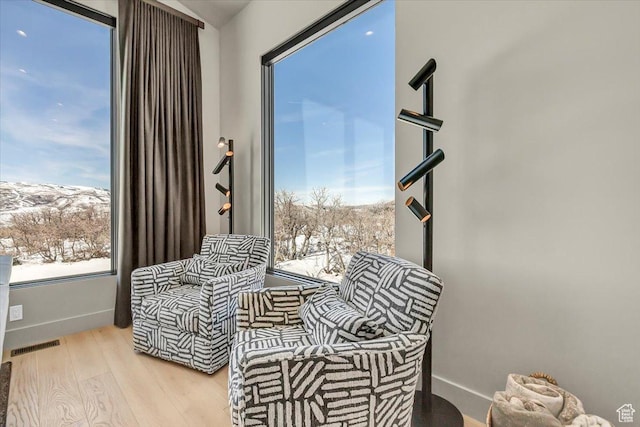 11503 N Soaring Hawk Ln, Hideout, UT 84036 - sitting room with wood finished floors and healthy amount of natural light