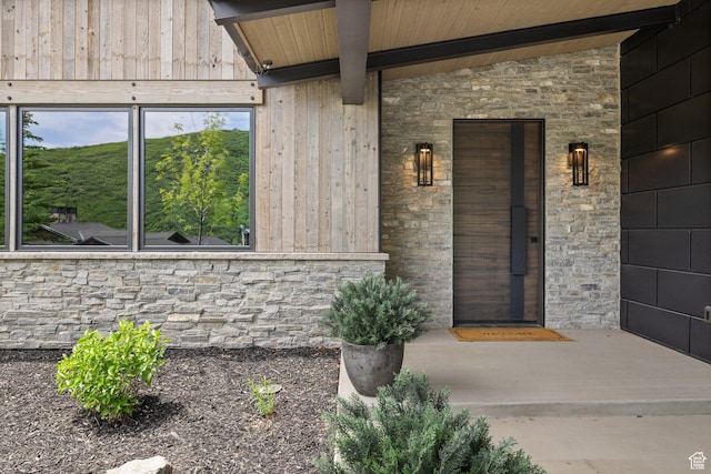11503 N Soaring Hawk Ln, Hideout, UT 84036 - property entrance with stone siding and a porch