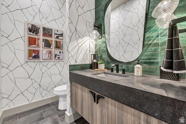 11503 N Soaring Hawk Ln, Hideout, UT 84036 - bathroom with vanity, tile walls, and stone finish flooring