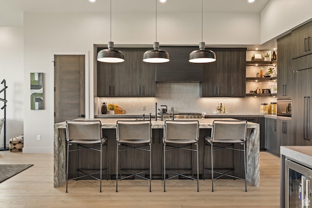 11503 N Soaring Hawk Ln, Hideout, UT 84036 - kitchen featuring modern cabinets, light wood-style floors, open shelves, decorative backsplash, and recessed lighting