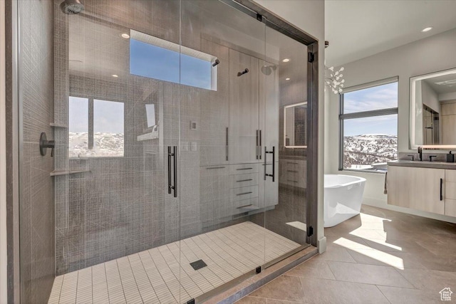 11503 N Soaring Hawk Ln, Hideout, UT 84036 - full bath featuring vanity, a freestanding tub, a shower stall, recessed lighting, and tile patterned floors