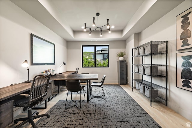 11503 N Soaring Hawk Ln, Hideout, UT 84036 - office featuring a raised ceiling, wood finished floors, and a chandelier