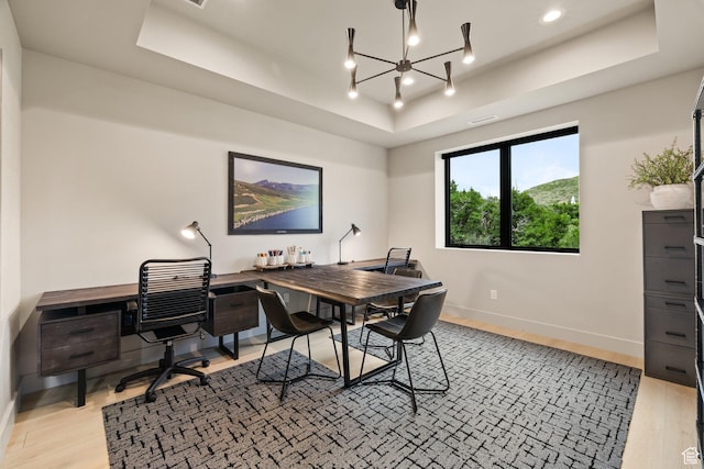 11503 N Soaring Hawk Ln, Hideout, UT 84036 - office area featuring a raised ceiling, light wood-style flooring, a chandelier, and recessed lighting