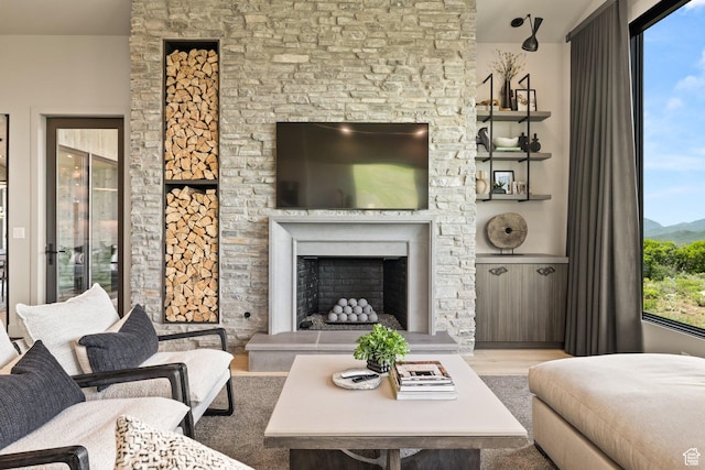 11503 N Soaring Hawk Ln, Hideout, UT 84036 - living area with wood finished floors and a fireplace with raised hearth