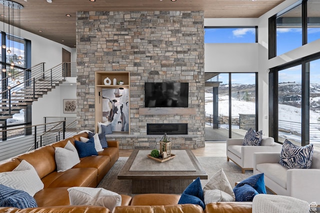 6421 E Evening Star Dr, Kamas, UT 84036 - living area with a stone fireplace, a high ceiling, and wood ceiling