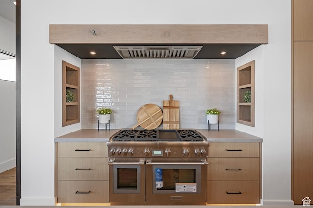6421 E Evening Star Dr, Kamas, UT 84036 - kitchen with range with two ovens, tasteful backsplash, light brown cabinetry, and light countertops