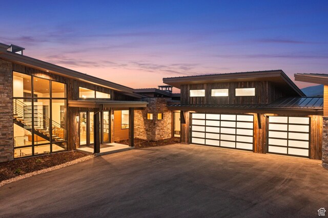 6421 E Evening Star Dr, Kamas, UT 84036 - view of front of home with a garage, stone siding, and concrete driveway