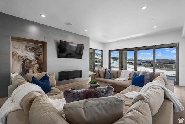 6421 E Evening Star Dr, Kamas, UT 84036 - living room with recessed lighting, wood finished floors, baseboards, and a large fireplace