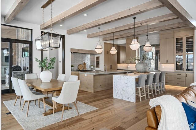 6421 E Evening Star Dr, Kamas, UT 84036 - dining area featuring light wood-style flooring, a notable chandelier, recessed lighting, and beamed ceiling