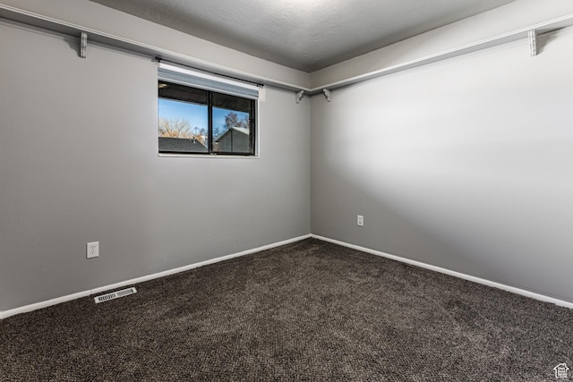 1325 S Lincoln Ave Unit 19, Ogden, UT 84404 - spare room with visible vents, a textured ceiling, baseboards, and carpet