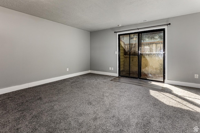 1325 S Lincoln Ave Unit 19, Ogden, UT 84404 - spare room featuring baseboards, carpet floors, and a textured ceiling