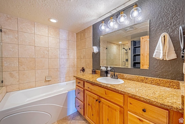 2669 Canyons Resort Dr Unit 314, Park City, UT 84098 - bathroom with a stall shower, tile patterned flooring, a textured ceiling, a bath, and a textured wall