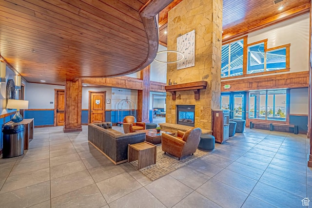 2669 Canyons Resort Dr Unit 314, Park City, UT 84098 - living room with a fireplace, wooden ceiling, a towering ceiling, and tile patterned flooring