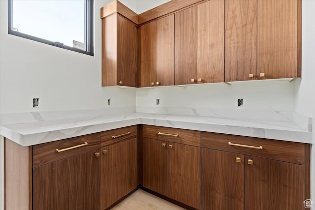1878 E Chimney Rock Rd S Unit 536, Heber City, UT 84032 - kitchen with brown cabinetry and light stone counters