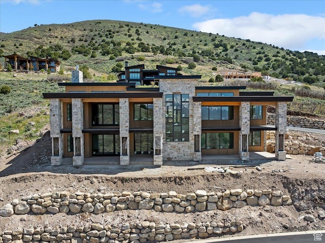 1878 E Chimney Rock Rd S Unit 536, Heber City, UT 84032 - doorway to property with stone siding and a mountain view