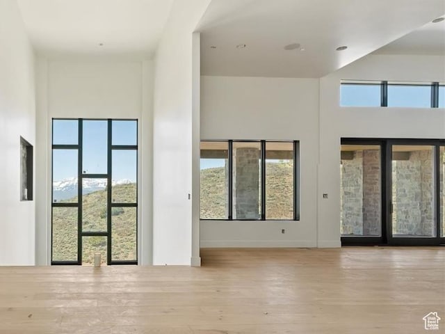 1878 E Chimney Rock Rd S Unit 536, Heber City, UT 84032 - unfurnished room with plenty of natural light, wood finished floors, and baseboards