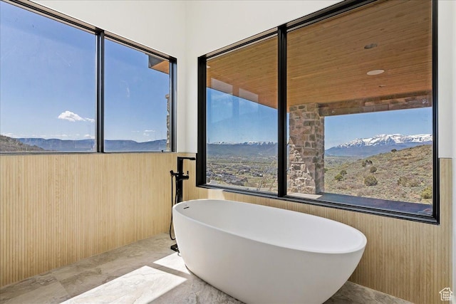 1878 E Chimney Rock Rd S Unit 536, Heber City, UT 84032 - bathroom featuring a soaking tub, marble tiled flooring, and a mountain view