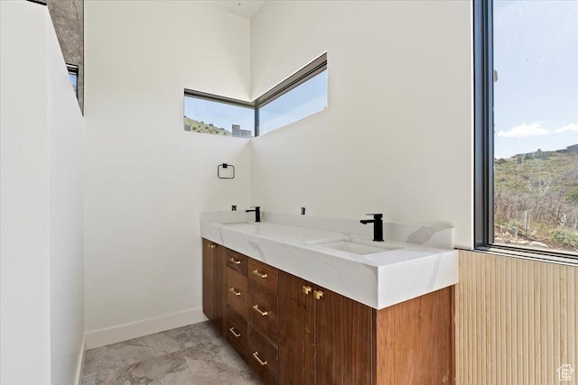 1878 E Chimney Rock Rd S Unit 536, Heber City, UT 84032 - bathroom with plenty of natural light, marble finish flooring, double vanity, and baseboards
