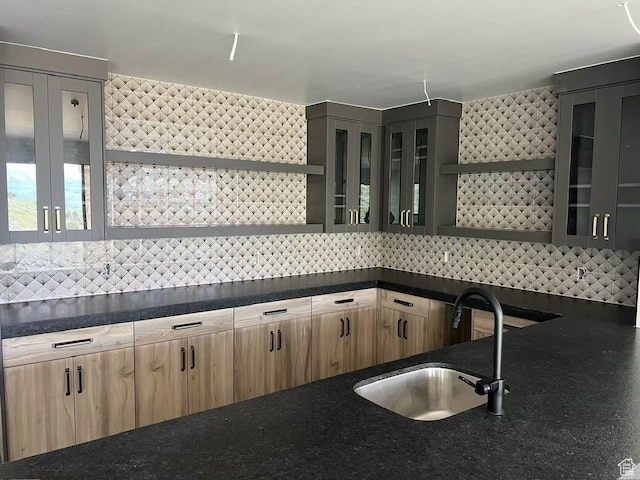 1878 E Chimney Rock Rd S Unit 536, Heber City, UT 84032 - kitchen featuring open shelves, a sink, backsplash, light brown cabinetry, and glass insert cabinets