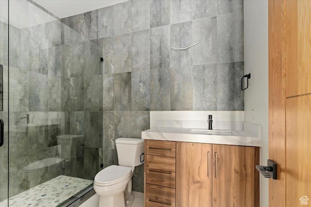 1878 E Chimney Rock Rd S Unit 536, Heber City, UT 84032 - bathroom with toilet, a shower stall, vanity, and tile walls