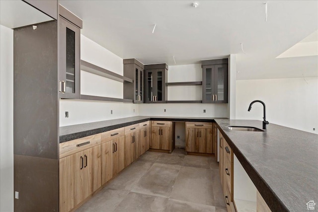 1878 E Chimney Rock Rd S Unit 536, Heber City, UT 84032 - kitchen with a sink, open shelves, light brown cabinets, glass insert cabinets, and concrete floors