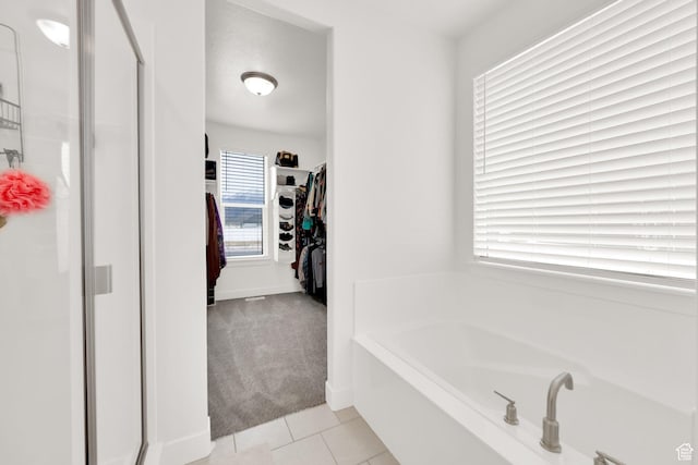 2998 E 80 S, Spanish Fork, UT 84660 - full bathroom featuring a spacious closet, tile patterned flooring, a stall shower, and a garden tub