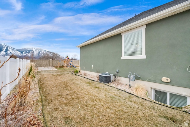 2998 E 80 S, Spanish Fork, UT 84660 - view of property exterior with central air condition unit, fence, a mountain view, a playground, and a yard