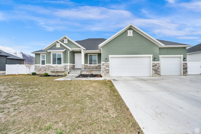 2998 E 80 S, Spanish Fork, UT 84660 - craftsman-style house with driveway, a front yard, stucco siding, fence, and a garage