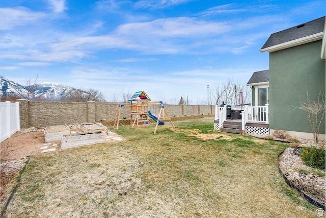 2998 E 80 S, Spanish Fork, UT 84660 - view of yard with a wooden deck, a fenced backyard, a vegetable garden, and a playground