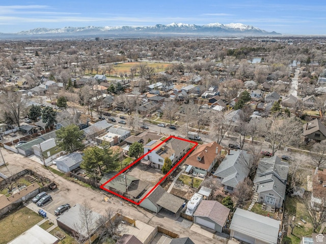 drone / aerial view with a residential view and a mountain view