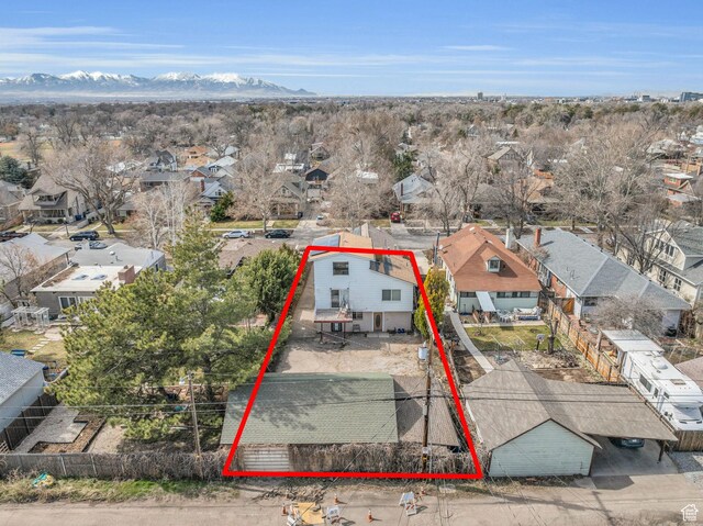 birds eye view of property featuring a residential view and a mountain view