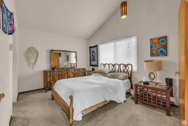 bedroom featuring vaulted ceiling, carpet flooring, and baseboards
