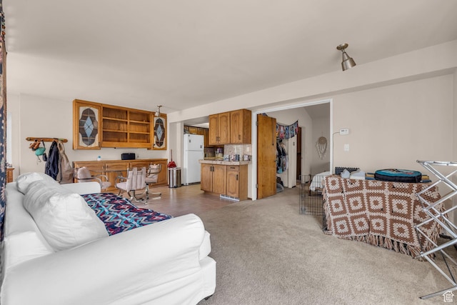 living area with light carpet