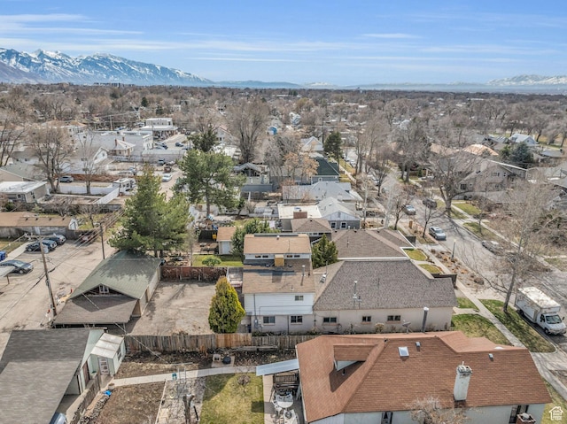 birds eye view of property with a mountain view and a residential view