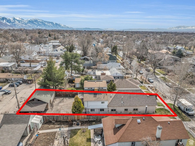 drone / aerial view featuring a mountain view and a residential view