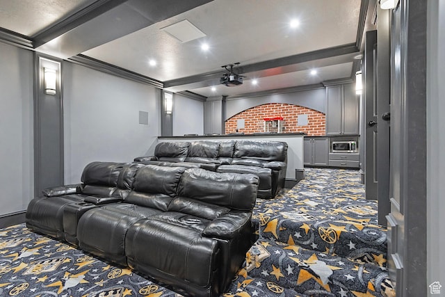 carpeted cinema room with crown molding, recessed lighting, and beam ceiling