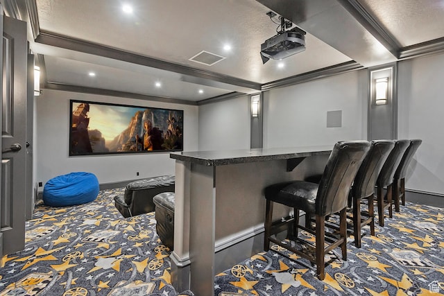 carpeted cinema featuring baseboards, recessed lighting, a dry bar, and ornamental molding