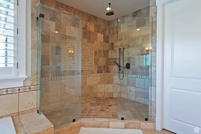 bathroom with a shower stall