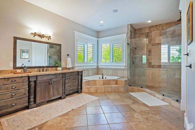 bathroom featuring healthy amount of natural light, a garden tub, a stall shower, and recessed lighting