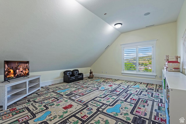 bonus room featuring vaulted ceiling, carpet flooring, and baseboards