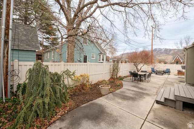 1689 E Kierstin Pl, Salt Lake City, UT 84108 - view of patio featuring a fenced backyard and outdoor dining space