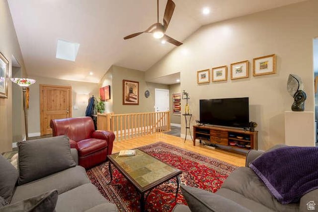 1689 E Kierstin Pl, Salt Lake City, UT 84108 - living room with vaulted ceiling with skylight, ceiling fan, and wood finished floors