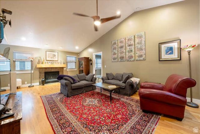 1689 E Kierstin Pl, Salt Lake City, UT 84108 - living room with a tiled fireplace, baseboards, ceiling fan, and wood finished floors