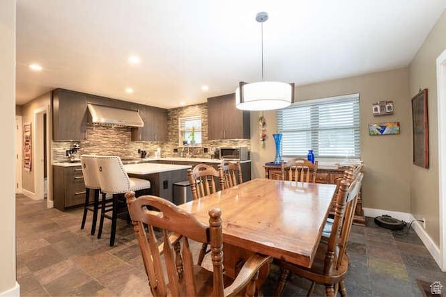 1689 E Kierstin Pl, Salt Lake City, UT 84108 - dining area with recessed lighting, stone finish flooring, and baseboards
