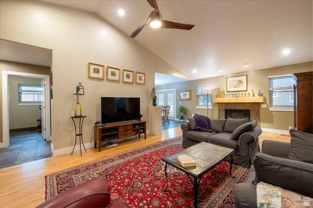 1689 E Kierstin Pl, Salt Lake City, UT 84108 - living room featuring high vaulted ceiling, a ceiling fan, wood finished floors, a fireplace, and baseboards